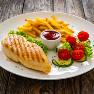 Chicken steak (Grilled chicken breast with vegetable and french fries)